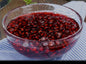 Heerlijke GranaatappelJam van Mijn winkel in een glazen kom, gevuld met sappige granaatappelpitten. Perfect voor op brood of als topping.
