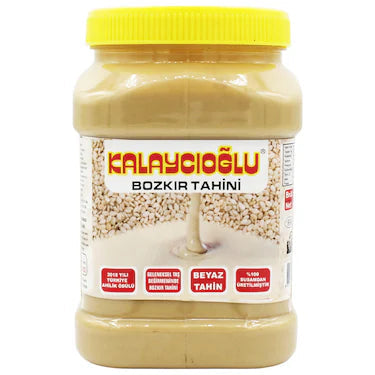 Bozkir Tahini van Mijn winkel in een stijlvolle glazen pot met een felgele deksel, perfect voor het bereiden van heerlijke gerechten.