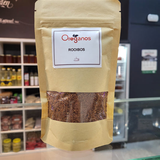 Verpakking van Rooibos Thee van Mijn winkel, met een duidelijke label van Oreganos, ideaal voor een gezonde thee-ervaring.