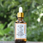 Flesje Propolis Udi Hindi van Mijn winkel, met een pipet en een prachtig groen natuurlijke achtergrond. Dit product combineert puur propolis-extract met Udi Hindi voor ondersteuning van het immuunsysteem.